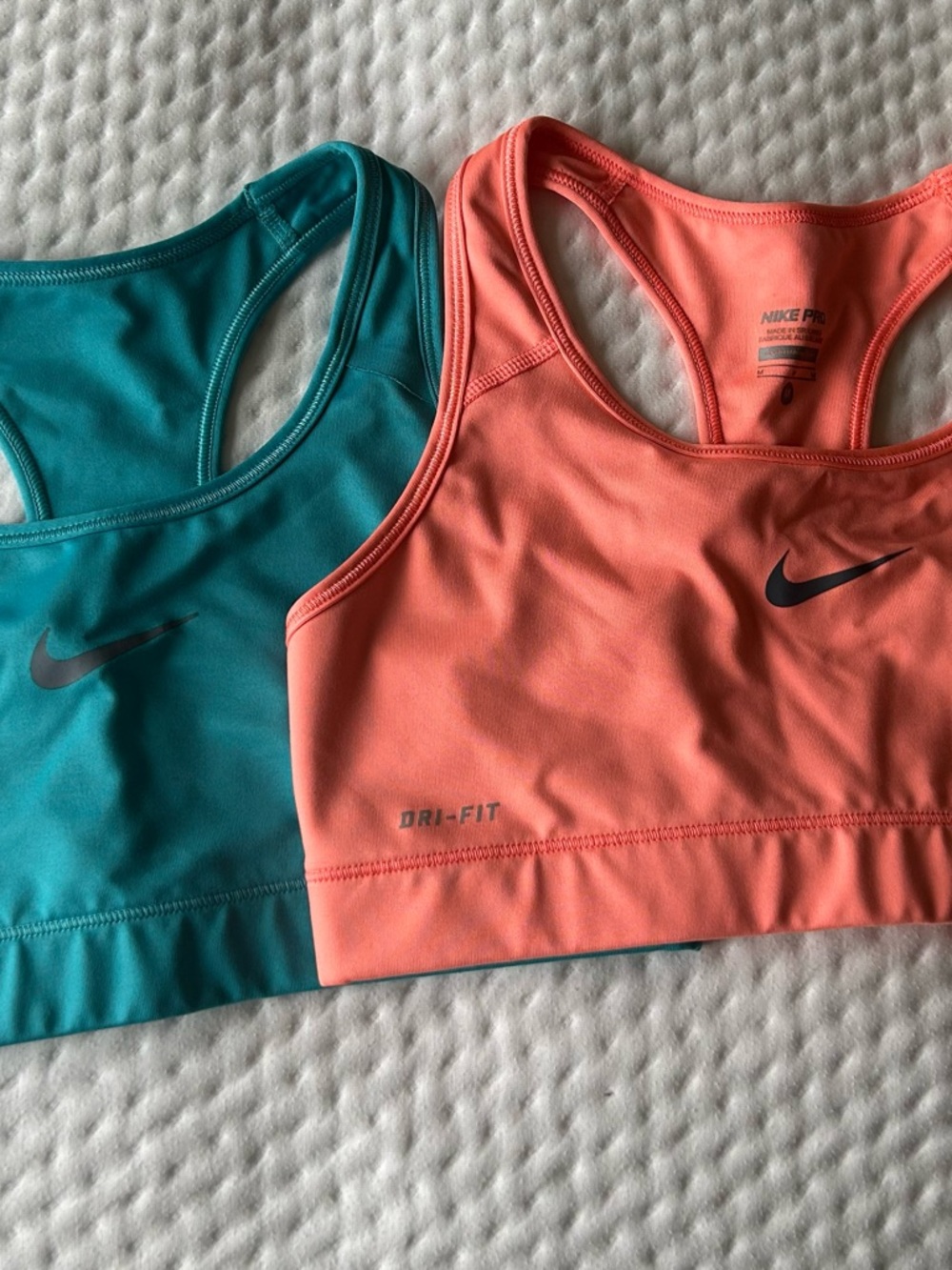 Nike Women's Coral and Teal Racerback Sports Bras